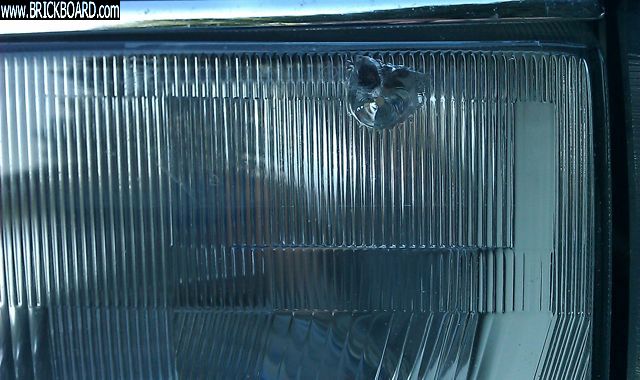 Volvo 200 -- damaged headlight lens