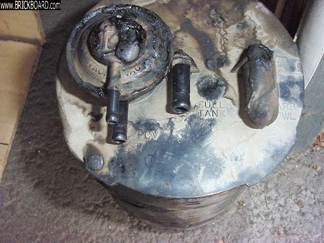 Volvo  -- 1990 Volvo 240 EVAP Canister Made by Rochester - Check Valve & Vac / Vapor Line Connect Detail