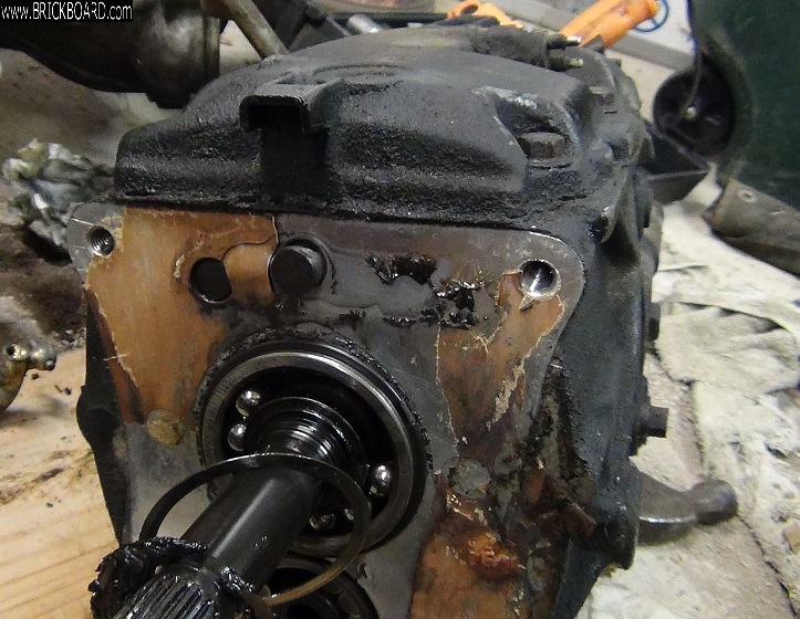 Volvo 200 -- m47 front main shaft bearing, shim, and melted plastic large view