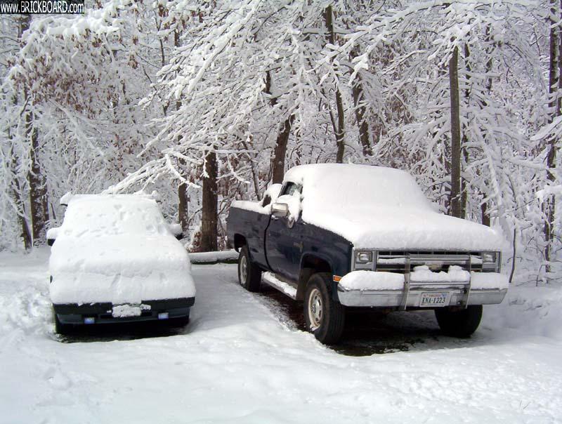 Volvo  -- 87 245 and Truck in the Snow